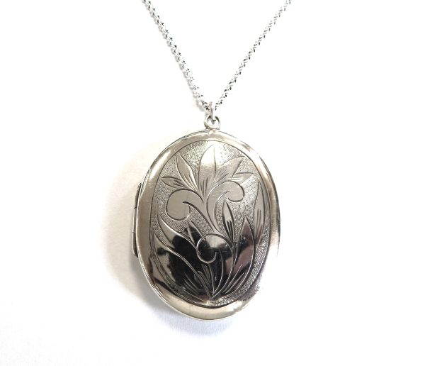 Pretty Oval Sterling Silver Locket with fine Belcher link Chain.