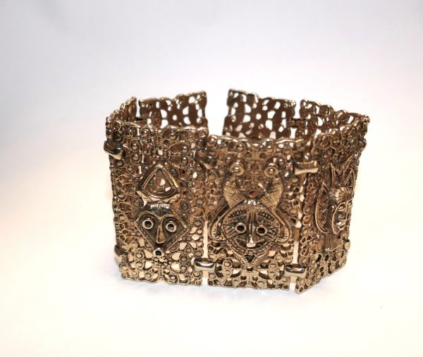Vintage Gold coloured cuff with African and NZ figures