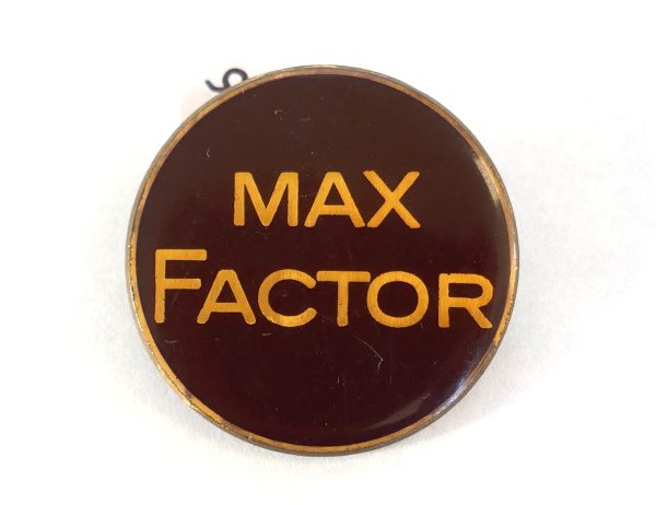 Enamel Max Factor Pin / brooch.